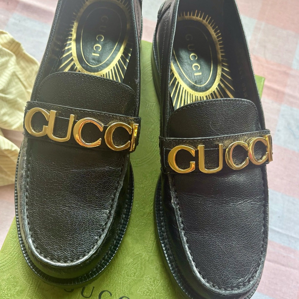 Gucci Black Loafers with Gold Emblem